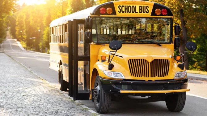 front-shot-of-parked-retro-yellow-school-bus-stand-2025-03-18-16-51-28-utc
